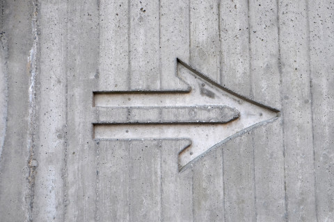 arrow carved into wall